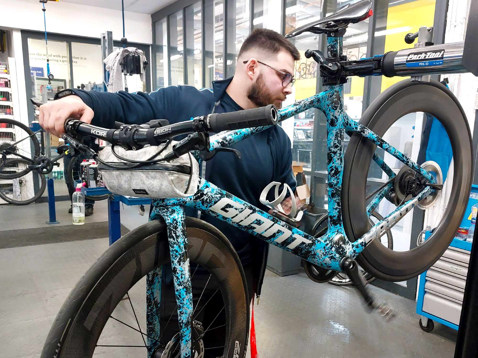 Bike mechanic. Bicycle Mechanics. Bike use uk. Washing a Mechanic Cycling Bike.